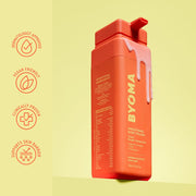 Flacon de vernis corporel BYOMA orange avec étiquettes sur fond jaune