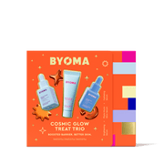 Emballage BYOMA Cosmic Glow Treat Trio sur fond orange