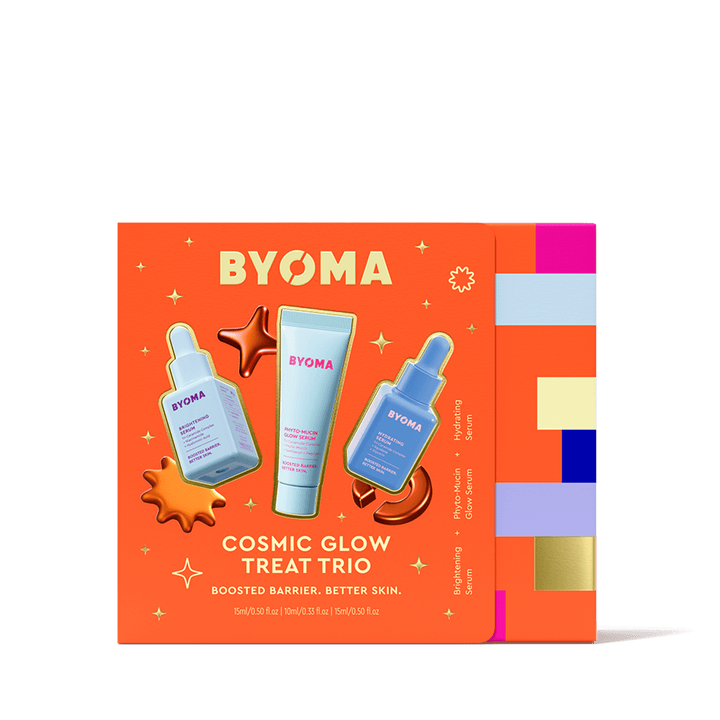 Emballage BYOMA Cosmic Glow Treat Trio sur fond orange