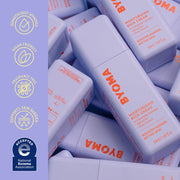 Flacons de crème riche hydratante BYOMA avec icônes de marque sur fond violet